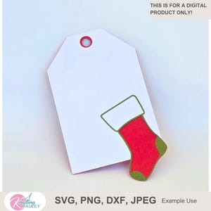 May include: A white gift tag with a red stocking graphic and a red eyelet. The stocking has a white cuff and green accents. Text at the top reads: THIS IS FOR A DIGITAL PRODUCT ONLY!
