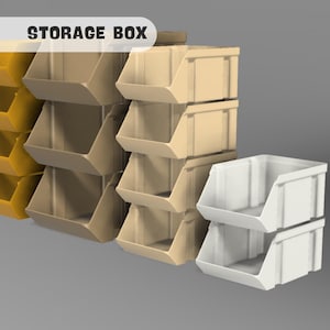 Peut inclure: Un ensemble de bo&icirc;tes de rangement en jaune, beige et blanc. Les bo&icirc;tes sont empil&eacute;es les unes sur les autres et sont &eacute;tiquet&eacute;es "STORAGE BOX".