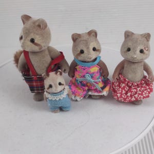 Vintage sylvanian racoon family of four calico critters