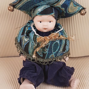 Vintage porcelain clown doll colorfull