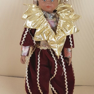 Vintage porcelain clown red doll