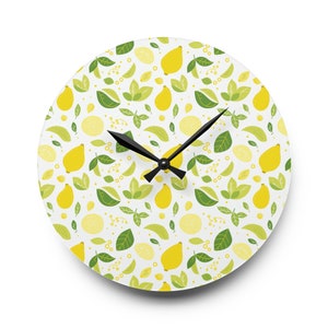 May include: A white round clock with black hands and a lemon pattern. The clock face is covered in yellow lemons, green leaves, and small white dots.