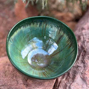 Ceramic bowl in green metallic glaze