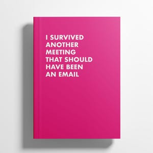 May include: A vibrant pink notebook featuring the white text: "I SURVIVED ANOTHER MEETING THAT SHOULD HAVE BEEN AN EMAIL". The notebook is rectangular and has a simple, modern design.