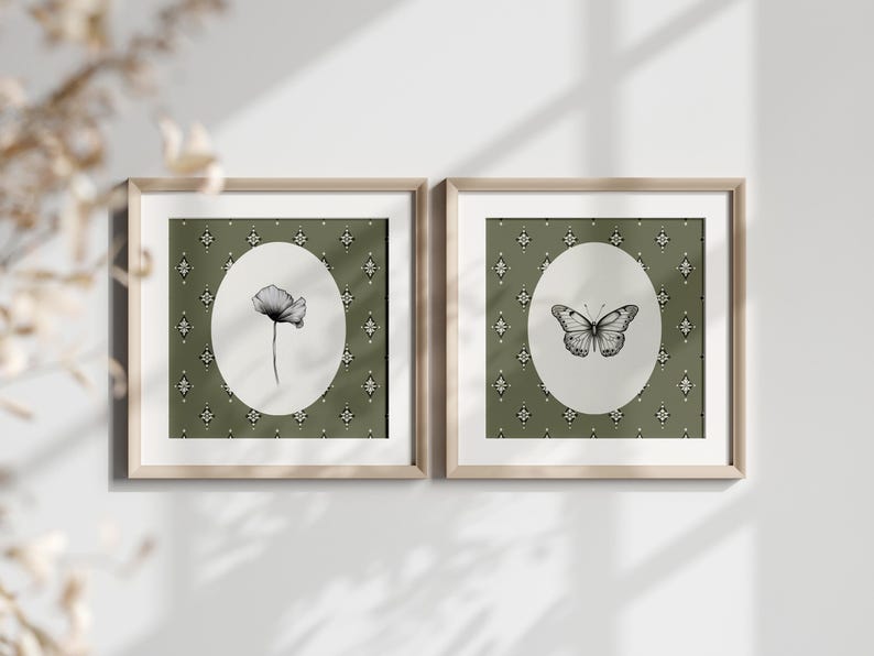 May include: Two framed prints with a green background and white oval frames. The left print features a black and white illustration of a flower. The right print features a black and white illustration of a butterfly.