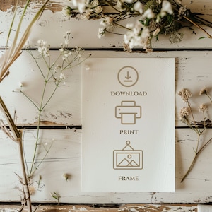 May include: A white card with brown text and icons. The text says "Download", "Print", and "Frame". The icons are a download arrow, a printer, and a picture frame.