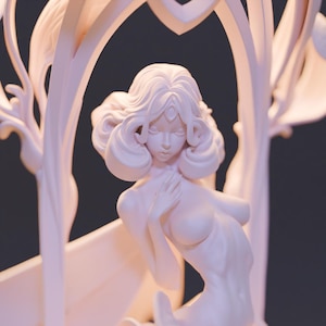 May include: A light pink sculpture of a woman emerging from a flower. The woman has curly hair and is posed with one hand on her chest. The sculpture is set against a dark background and is lit from the side.