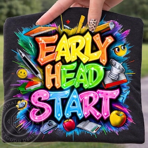 May include: A black t-shirt with the words "EARLY HEAD START" in colorful, graffiti-style lettering. The design includes school-themed graphics like a pen, apple, books, and a smiley face. The shirt is held up by a hand.