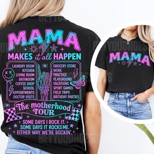May include: Black t-shirt with a vibrant graphic design. The design features the word "MAMA" in a gradient of pink and blue, along with the phrase "MAKES it all HAPPEN." Additional text lists various activities. A fun and stylish tee for mothers.