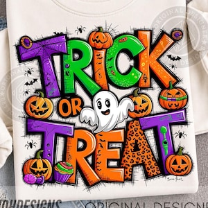 May include: A cream-colored sweatshirt featuring a colorful graphic with the text TRICK OR TREAT. The design includes orange jack-o'-lanterns, a white ghost, purple spiderwebs, and green accents, decorated with small spiders and bats.