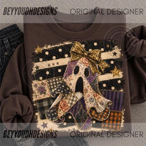 May include: A dark brown crewneck sweatshirt featuring a central graphic of a ghost adorned with a gold glitter bow. The ghost is composed of various patterned patches including floral, plaid, and spiderweb designs, set against a background of black and white stripes, polka dots, and gold stars.