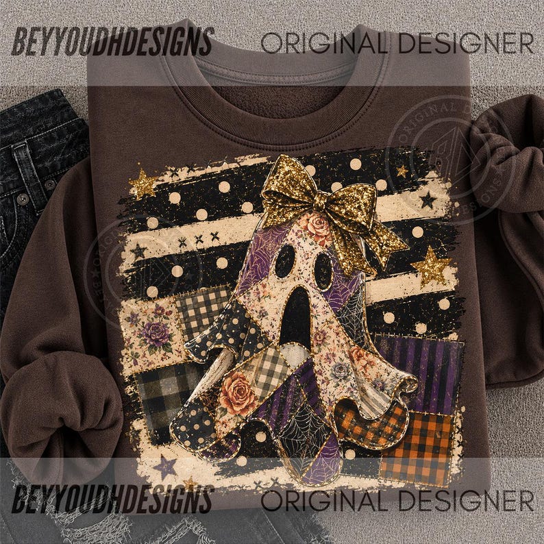 May include: A dark brown crewneck sweatshirt featuring a central graphic of a ghost adorned with a gold glitter bow. The ghost is composed of various patterned patches including floral, plaid, and spiderweb designs, set against a background of black and white stripes, polka dots, and gold stars.