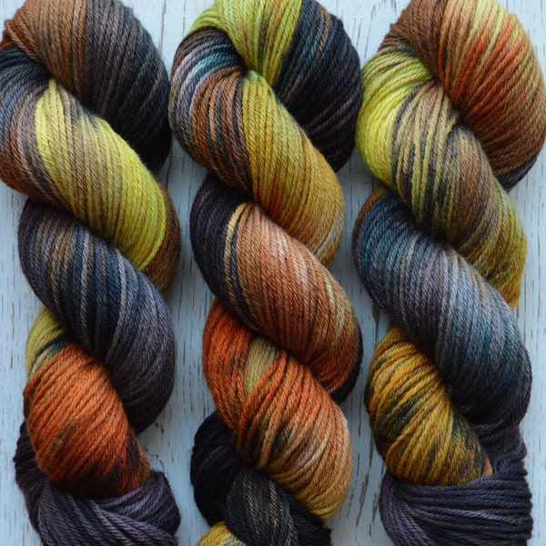 Grasshopper - worsted weight 4-ply 100% non-super wash extra fine soft merino yarn. Kettle dyed 100g 218 yds. Green yellow orange brown gray