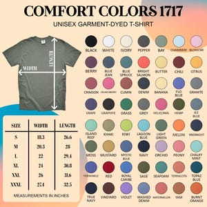 May include: An olive green unisex garment-dyed t-shirt with size and color options. The shirt's width is 18.3 inches and length is 26.6 inches for size small. Color options include black, white, and navy.