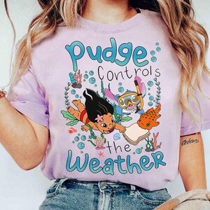 May include: A white ceramic mug with a black handle and the text "But First, Coffee" in a black, bold font. The mug is on a white surface. The mug appears to hold approximately 355 ml.