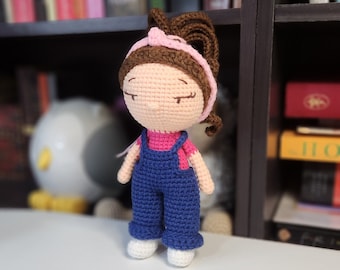 Crochet doll in pink shirt and overalls teacher
