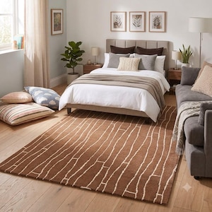 May include: A rectangular area rug featuring a solid brown background with a repeating pattern of thin, irregular white lines that resemble tree bark or organic wood grain textures, covering the floor in a bedroom setting.