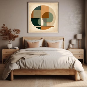 May include: A wooden bed frame with a white duvet and two peach-colored throw pillows. A framed abstract geometric print with green, brown, and beige colors hangs above the bed.