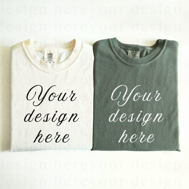 May include: Two blank t-shirts, one white and one green, with the text "Your design here" printed on each.