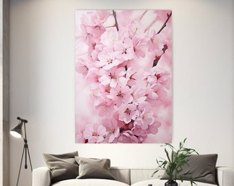 Puede incluir: Una fotografía de cerca de un grupo de flores de cerezo rosas. Las flores están en plena floración y tienen un aspecto suave y delicado. El fondo es un rosa y blanco borroso.