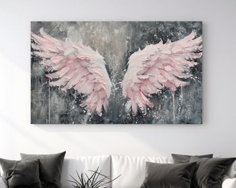 May include: A large, rectangular canvas art piece depicting a pair of pink angel wings against a gray and white textured background. The artwork hangs above a white sofa with black pillows. The room has a modern aesthetic.