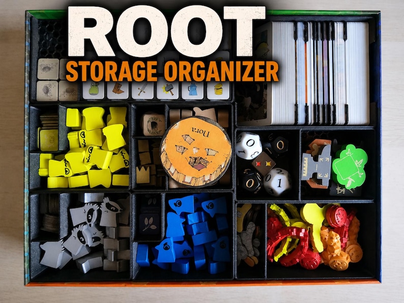 May include: A black board game storage organiser box containing various game components including yellow, blue, and grey wooden tokens, white dice, card decks, and a circular wooden token with the text Nora printed on the surface.