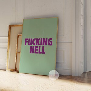May include: A light green canvas print with the words "FUCKING HELL" in bold, purple letters.