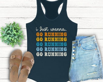 May include: A navy blue tank top with the text "i Just wanna... GO RUNNING" repeated five times in rainbow colors. The text is in a retro font style.