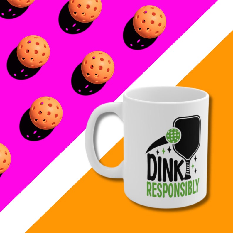 Background is bright pink, white and orange  with orange pickleballs in one corner and a  white coffee mug with Dink Responsibly funny Pickleball slogan on it bottom right corner.