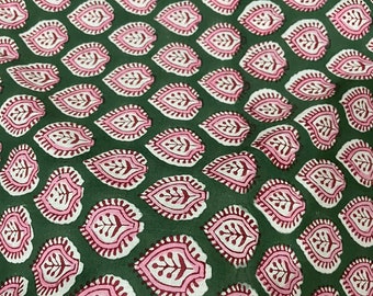 May include: Green fabric with a repeating pattern of pink and white leaves. The leaves have a detailed design with a burgundy outline.
