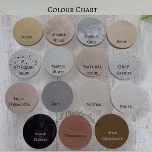 May include: A color chart featuring twelve circular samples in various shades, including beige, gray, and terracotta. Each sample is labeled with its color name, such as "Marble Beige" and "Milk Chocolate". The text "COLOUR CHART" is at the top.