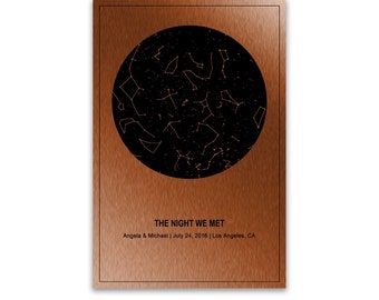 May include: A copper-colored framed print featuring a black circle with a constellation design. The text "THE NIGHT WE MET" is above the names Angela & Michael, date, and location. The words "CLASSIC STYLE" are at the bottom.