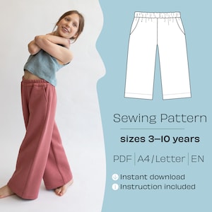 May include: A sewing pattern for wide-leg pants for children, sizes 3-10 years. The pattern is available as a PDF download and includes instructions. The image shows a young girl wearing a pair of pink pants made from the pattern.