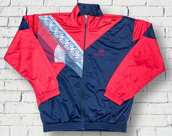 Sergio Tacchini Vintage 90er Jahre mehrfarbige geometrische Jacke – Sport-Trainingsjacke – Tennis- und Laufsportjacke mit durchgehendem Reißverschluss – Größe XL