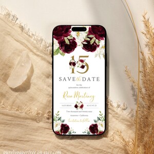 May include: A save the date card for a quincea&ntilde;era celebration. The card features a floral design with burgundy and white roses, and gold lettering. The text reads "Save the Date for the Quincea&ntilde;era celebration of Rosa Martinez, Saturday, August 25, Two thousand and twenty xxxx, Anytown, California, Invitation to follow."