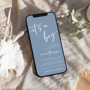 May include: A blue and white baby shower invitation on a smartphone screen. The invitation reads "It's a boy" in white script. The invitation includes the name "maeve thompson" and details for the baby shower.