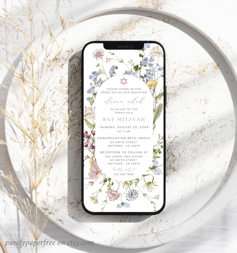 May include: A floral-themed digital invitation for a Bat Mitzvah. The invitation features a pink and white floral design with a Star of David in the center. The text reads "Please share in our great joy as our daughter Olivia Adah is called to the Torah as a Bat Mitzvah. Sunday, August 25, 20XX at 11 AM. Congregation Beth Isreal 123 Smith Street Anytown, CA 45678. Reception to follow at The Lemon Tree Bistro 123 Smith Street Anytown, CA 45678. RSVP to 123 456 7890."