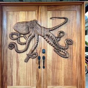 Custom Carved Doors for homes and businesses. Octopus, ocean theme, and any art on custom made doors by Puna Carver