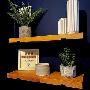 Wooden Rustic  shelf made from sustainable resourced wood  Black bracket included. great for any room or can be finished for the outside