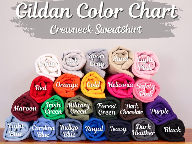 May include: Gildan Color Chart for Crewneck Sweatshirts. The chart shows a variety of colors, including white, ash, sport gray, sand, light pink, red, orange, gold, heliconia, safety pink, maroon, Irish green, military green, forest green, dark chocolate, purple, light blue, Carolina blue, indigo blue, royal blue, navy, dark heather, and black.