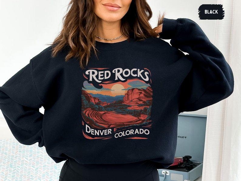 May include: Black sweatshirt with a graphic print of a red rock landscape with the text "Red Rocks Denver Colorado".