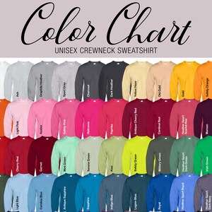 May include: Color chart showing various colors of unisex crewneck sweatshirts. Colors include white, ash, graphite heather, sport gray, charcoal, dark heather, yellow haze, old gold, gold, safety orange, orange, light pink, azalea, safety pink, heliconia, paprika, antique cherry red, cardinal red, heather sport, scarlet red, maroon, forest, red, cherry red, garnet, mint green, serene green, kiwi, safety green, military green, heather sport, dark green, irish green, light blue, carolina blue, antique sapphire, sapphire, indigo blue, legion blue, royal, heather sport royal, dark navy.