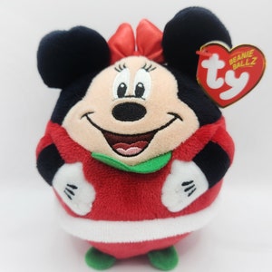 Puede incluir: Juguete de peluche rojo y blanco de Minnie Mouse con un traje de Pap&aacute; Noel rojo y blanco con ribete verde. El juguete tiene una etiqueta Ty Beanie Ballz unida a su oreja.