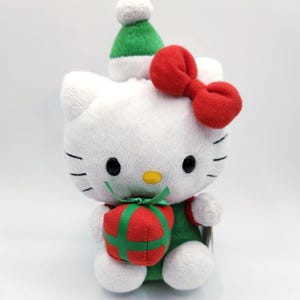 Ty Beanie Baby “Hello Kitty” with Green Holiday Hat Holding a Present (6 inch)