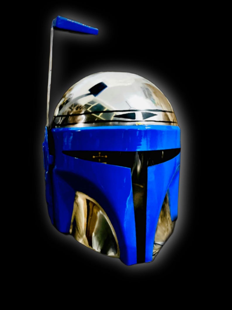 May include: A blue and silver helmet with a visor and a small antenna on top. The helmet has a black stripe down the center.