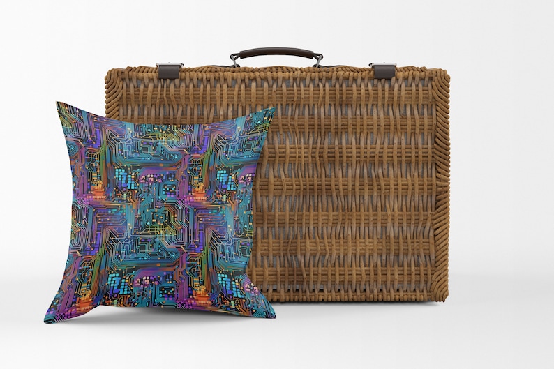 May include: A woven wicker suitcase with a brown leather handle and a blue, green, and purple pillow with a circuit board pattern.