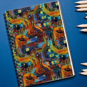 May include: A spiral bound notebook with a colorful circuit board design. The cover features a pattern of orange, yellow, blue, and black lines.