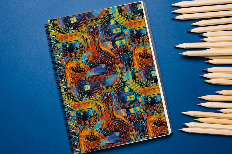 May include: A spiral bound notebook with a colorful circuit board design. The cover features a pattern of orange, yellow, blue, and black lines.