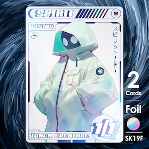 May include: A holographic trading card featuring a white and green character with a black face mask. The card is titled "Spirit" and has the text "Flying" and "Token Creature" on it. The card is labeled "Foil" and has a holographic sticker with the text "SK19F".