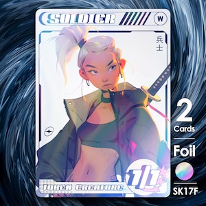 May include: A holographic trading card featuring a female character with white hair and a sword. The card is labeled "SOLDIER" and has a power rating of "1/1". The card is labeled "Token Creature" and has a foil finish.